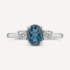 9ct White Gold Oval Blue Topaz & 0.15ct Diamond Sides Ring
