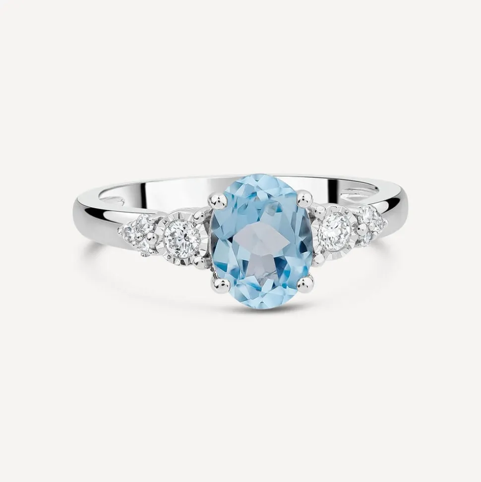 9ct White Gold Oval Blue Topaz Centre 0.14ct Diamond Trefoil Sides Ring