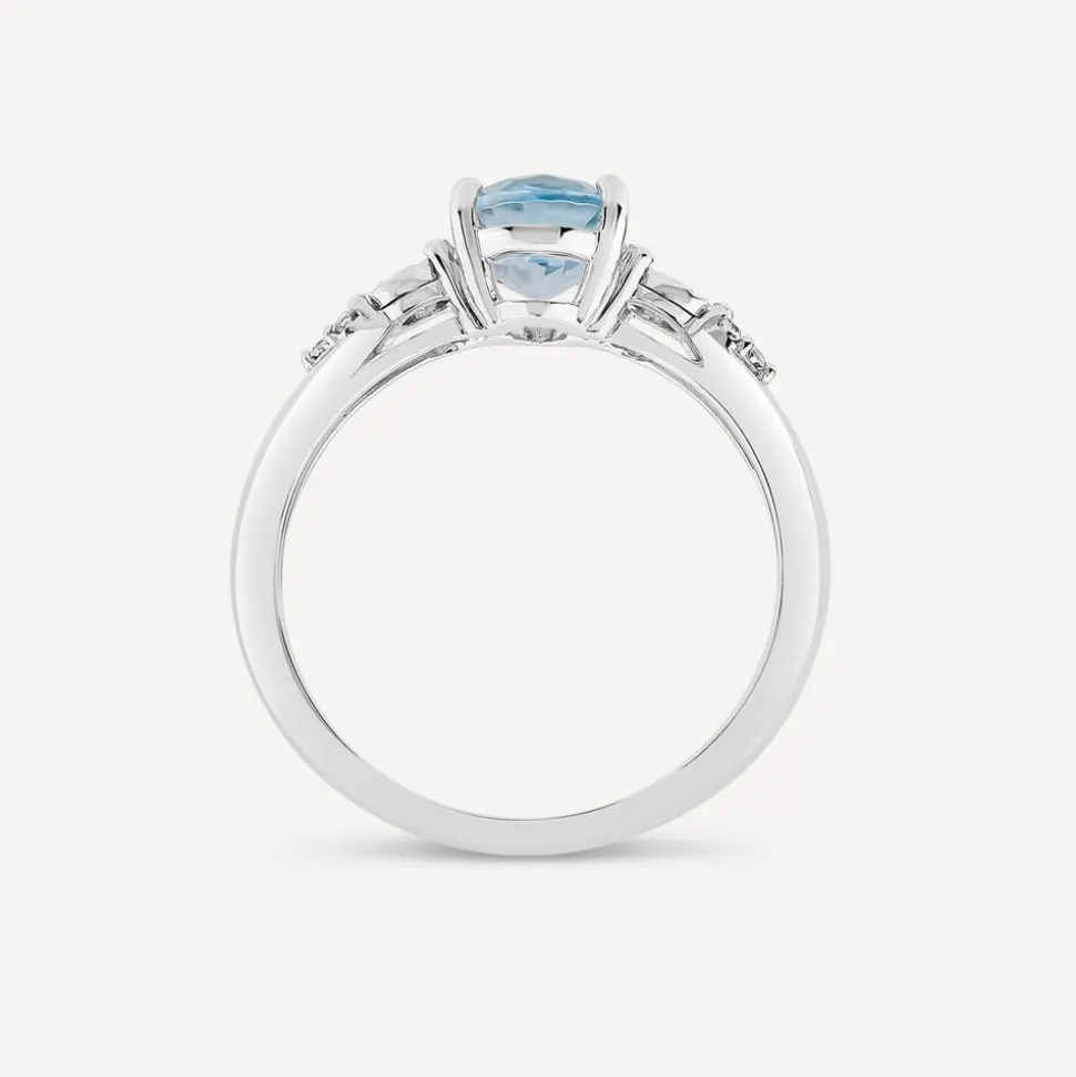 9ct White Gold Oval Blue Topaz Centre 0.14ct Diamond Trefoil Sides Ring