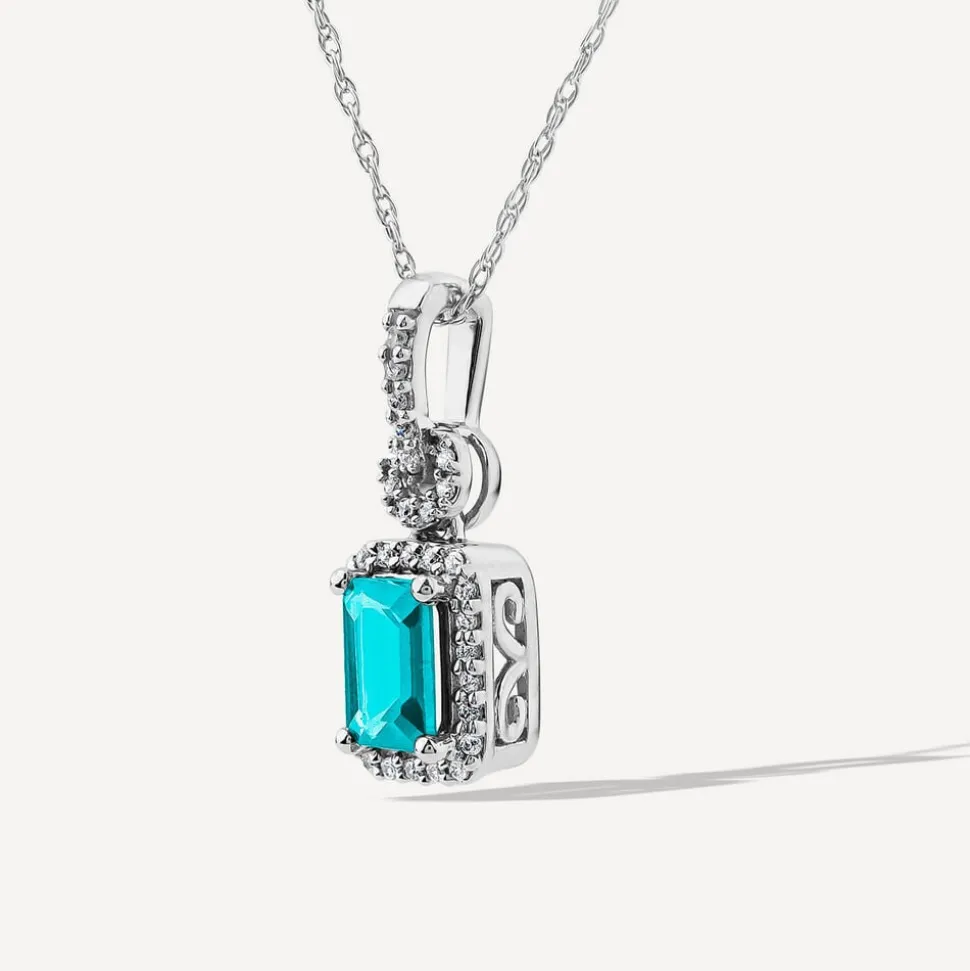 9ct White Gold Rectangular Blue Topaz & 0.10ct Diamond Halo Pendant