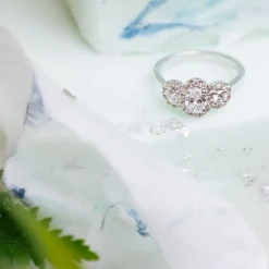 Kathy De Stafford 18ct White Gold ''Ivy'' 3 Stone Oval Centre Halo 0.85ct Ring