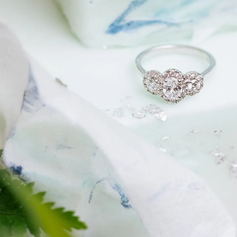 Kathy De Stafford 18ct White Gold ''Ivy'' 3 Stone Oval Centre Halo 0.85ct Ring